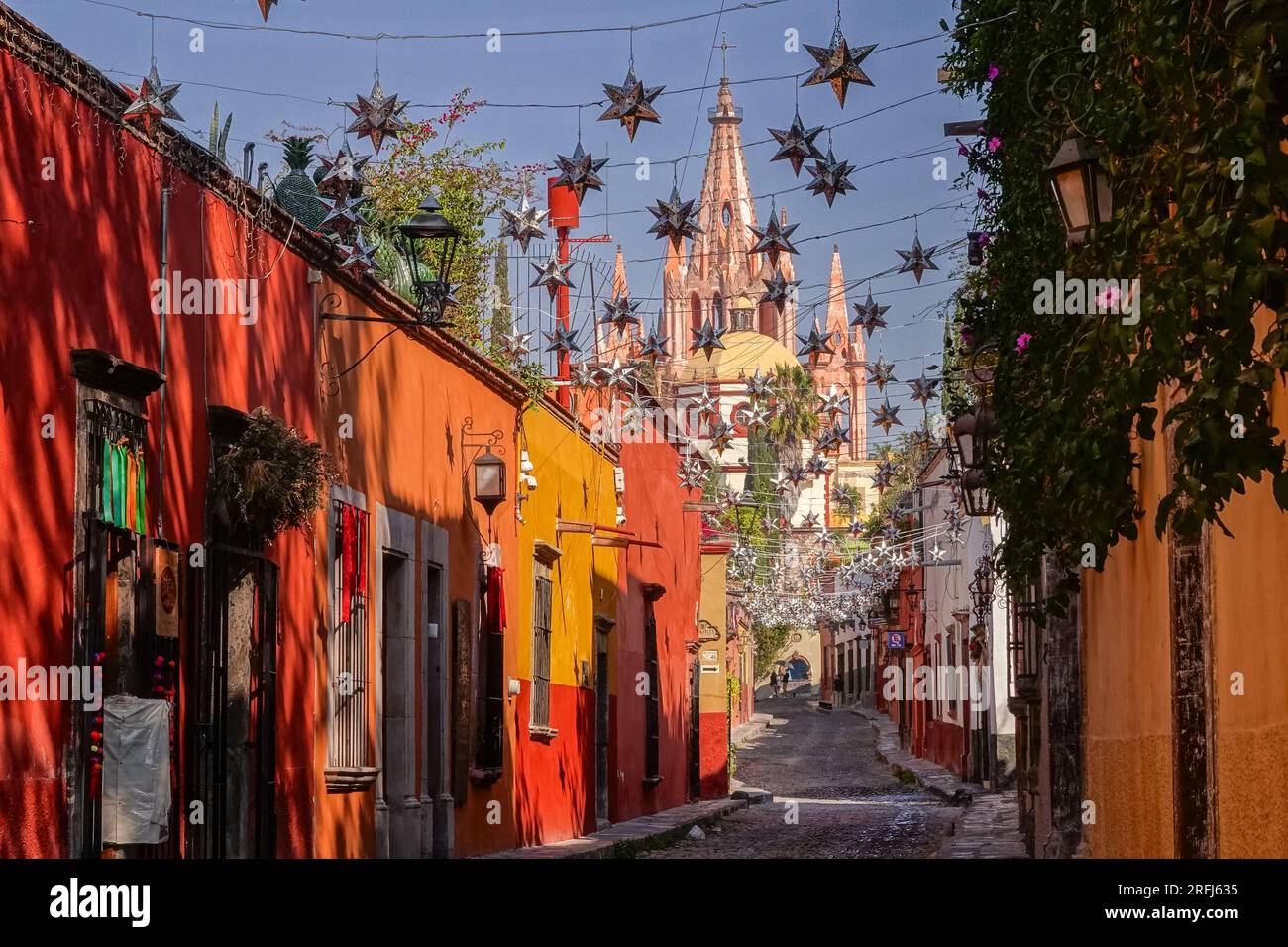 Mexican tin stars strung across the the cobblestone Calle Aldama with
