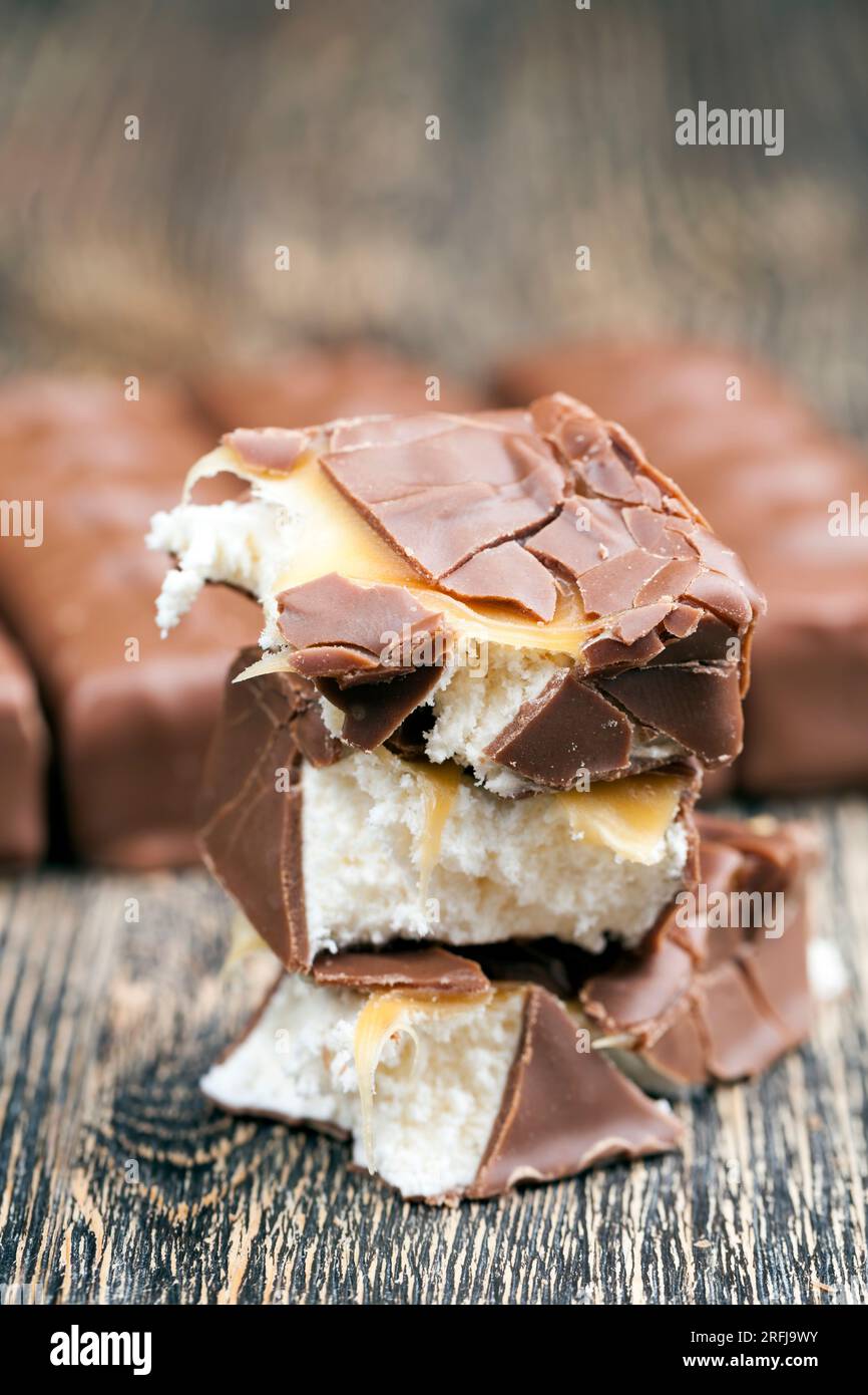 creamy nougat covered with milk chocolate, a chocolate bar made of