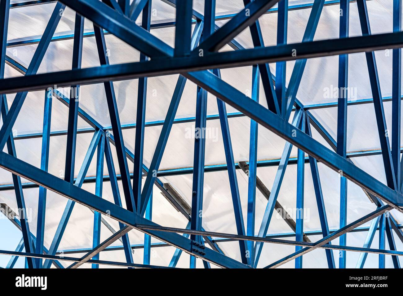steel beams structure of transparent roof. industrial building or warehouse. closeup bottom view. Stock Photo