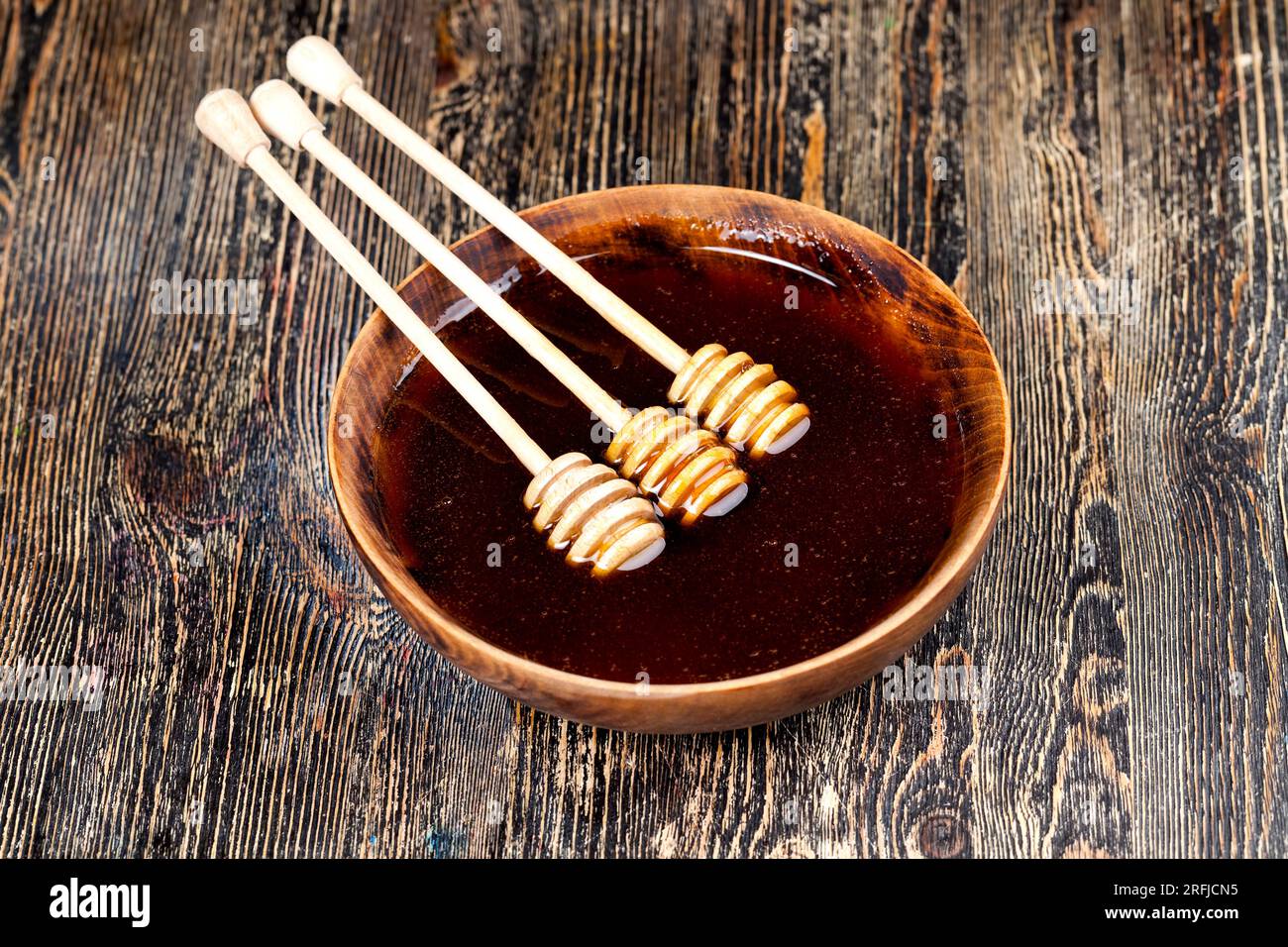 thick and sweet buckwheat honey of dark red color from buckwheat
