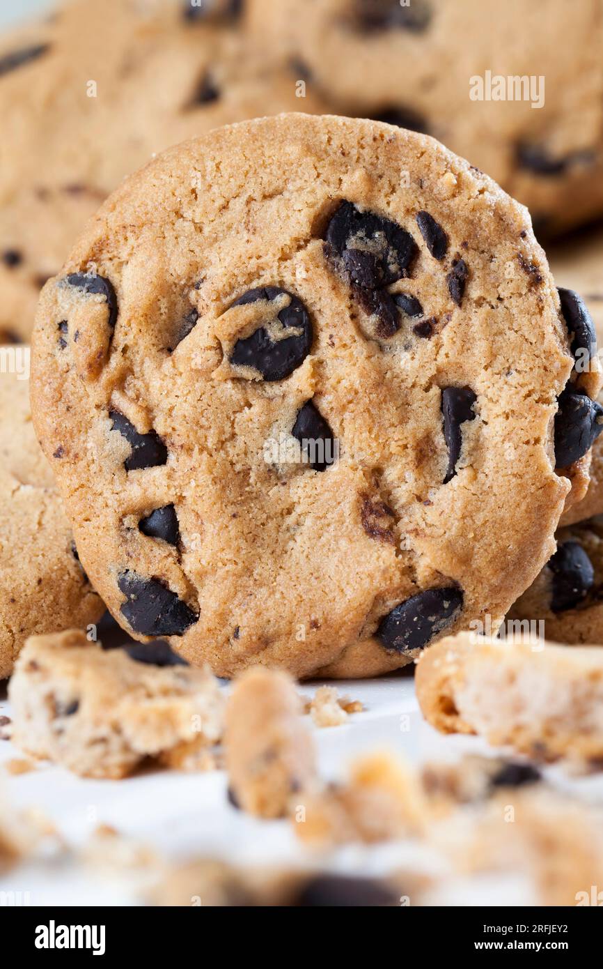 oatmeal cookies and large pieces of sweet chocolate together, cookies with chocolate pieces inside, close up food for desserts Stock Photo