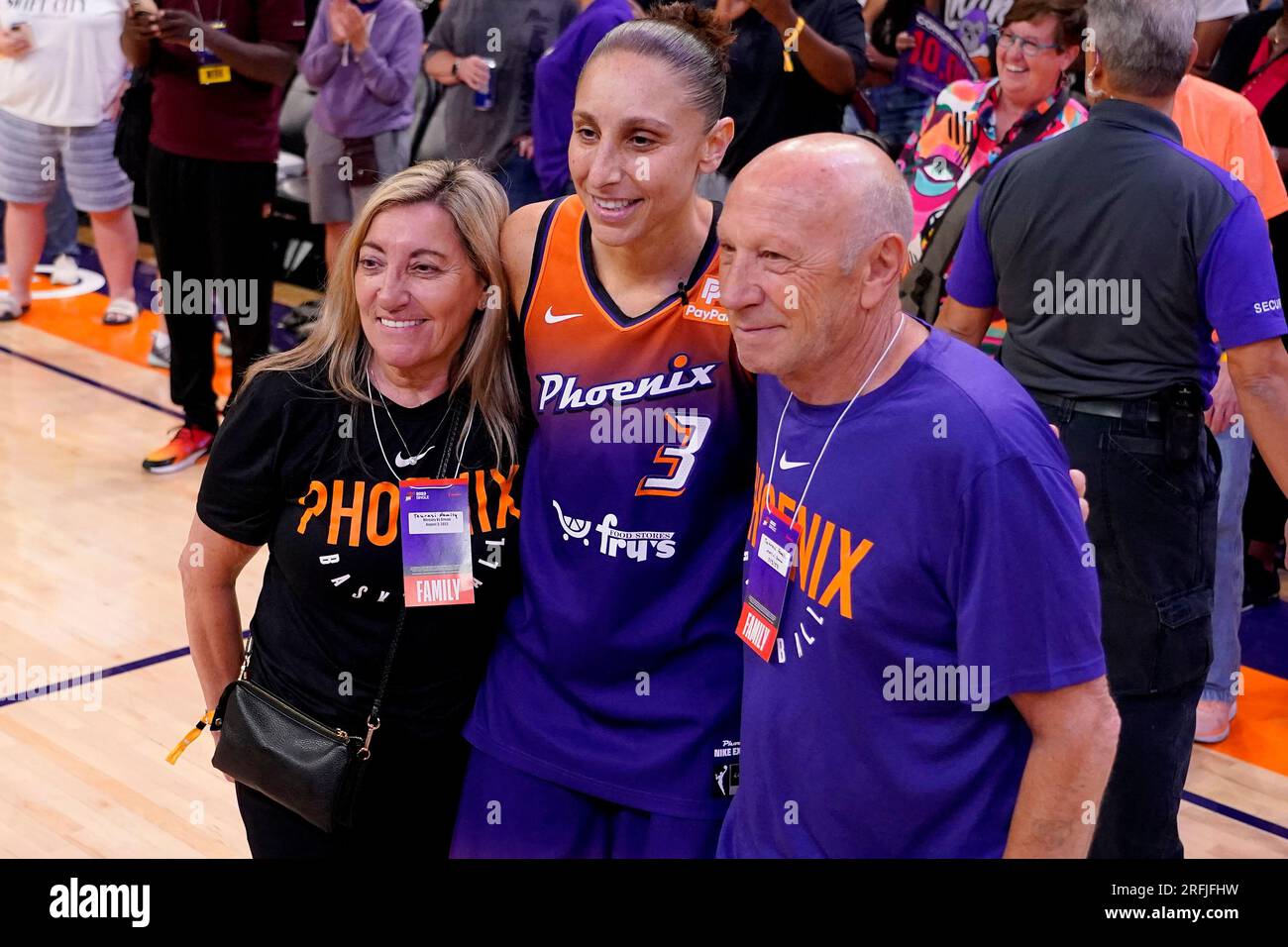 Phoenix Mercury guard Diana Taurus, center, has a picture taken with