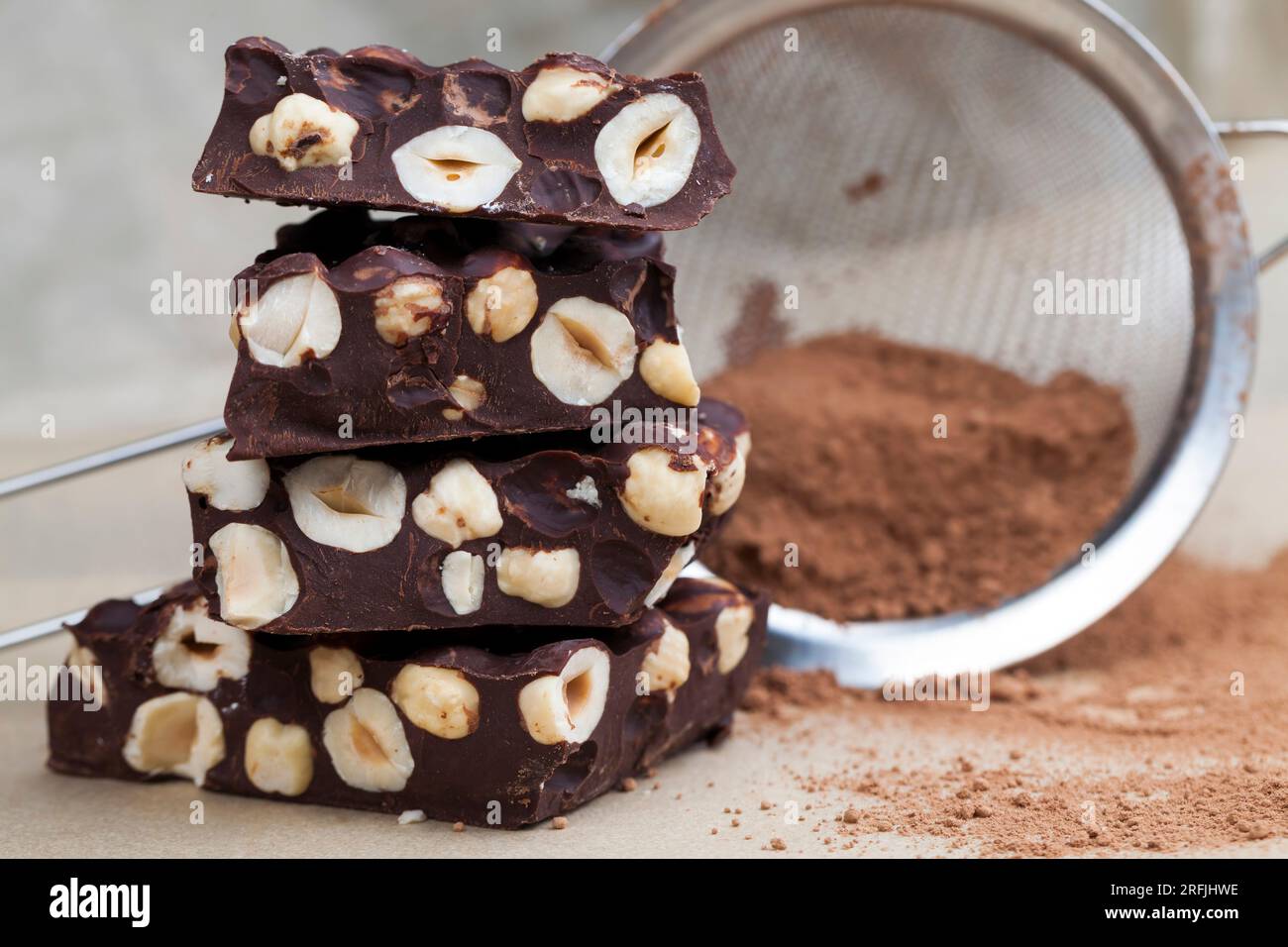 homemade bitter chocolate bar with roasted hazelnuts, bitter chocolate