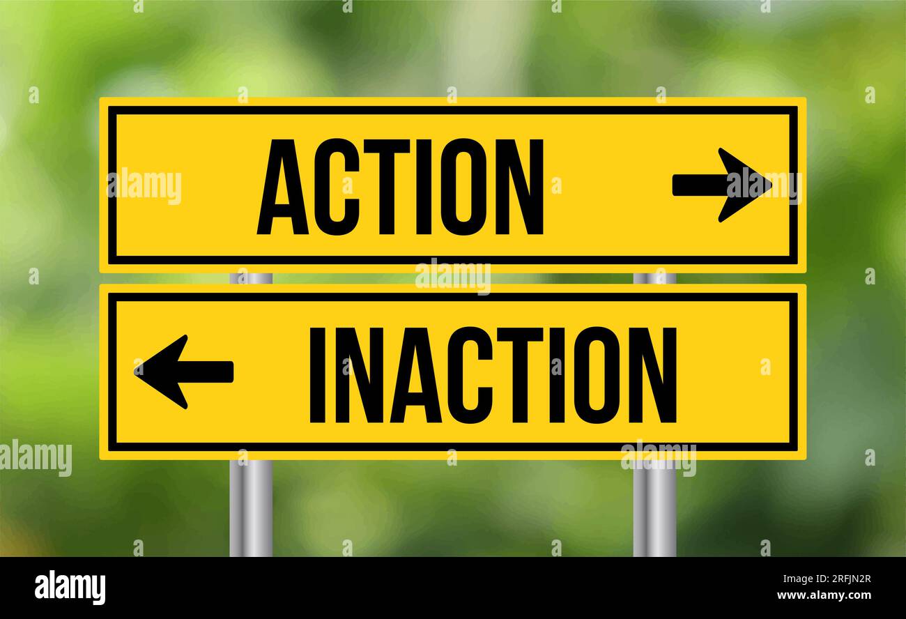 Action vs inaction road sign on blur background Stock Photo Alamy