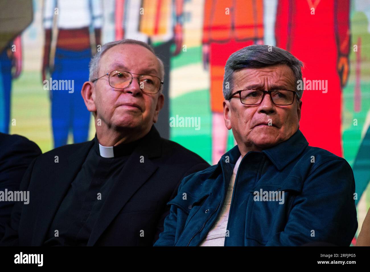 Bogota, Colombia. 03rd Aug, 2023. Monsignor Hector Henao (L) and National Liberation Army leader Israel Ramirez, alias 'Pablo Beltran' (R) during a ceremony to begin a six-month cease-fire as part of a process to begin a permanent peace between the ELN and the government in Bogota, Colombia on August 3, 2023. Credit: Long Visual Press/Alamy Live News Stock Photo