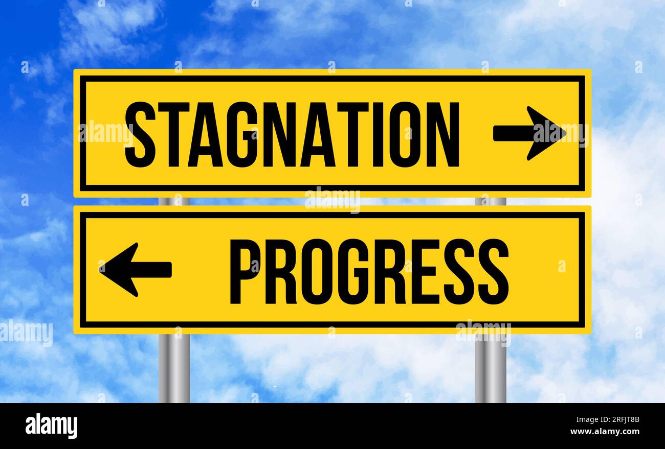 Stagnation or progress road sign on blue sky background Stock Photo Alamy