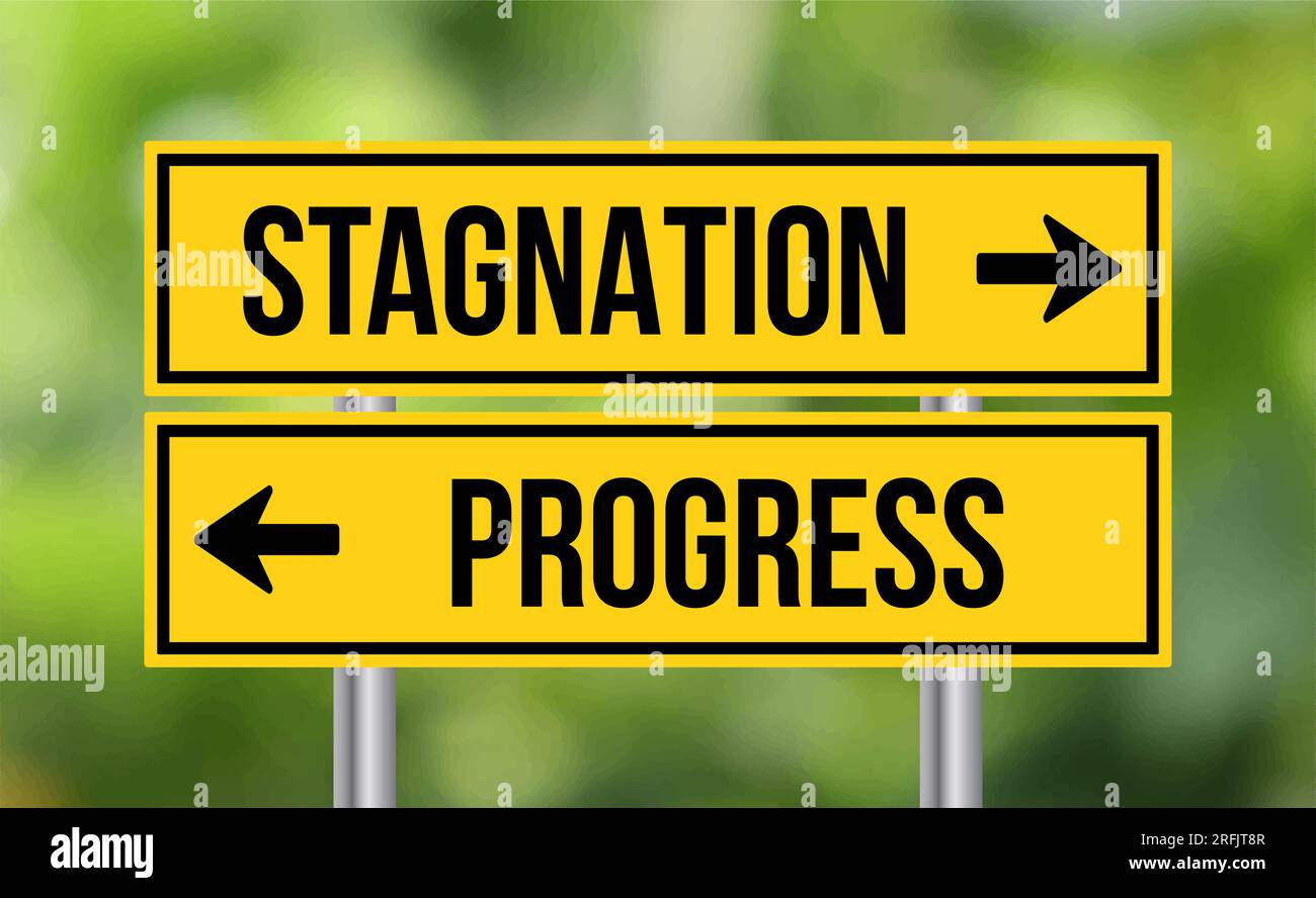 Stagnation or progress road sign on blur background Stock Photo Alamy