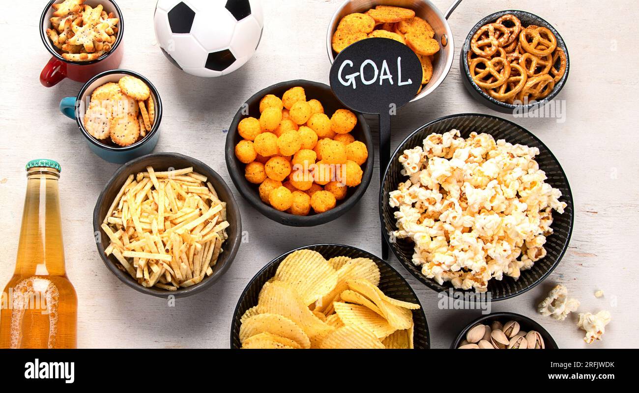 Beer bootles, snacks and ball on table. Top view, copy space Stock ...