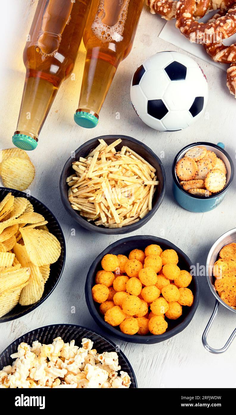 Beer bootles, snacks and ball on table. Top view, copy space Stock ...