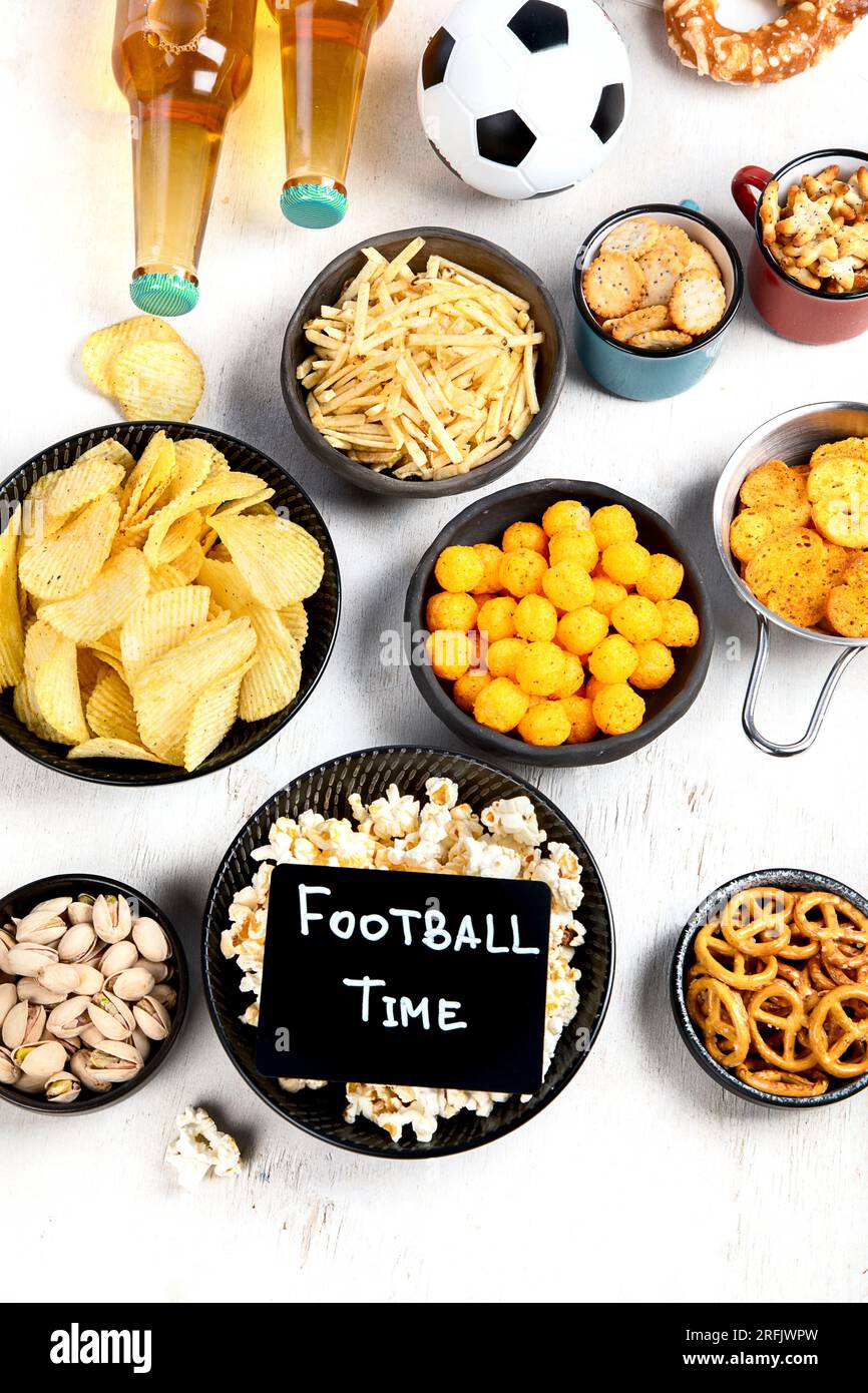 Beer bootles, snacks and ball on table. Top view, copy space Stock ...