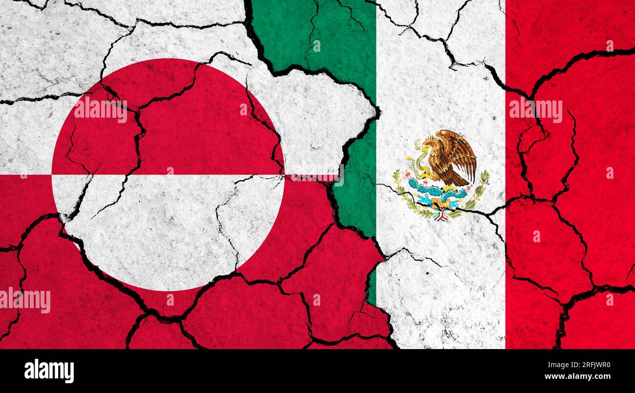 Flags of Greenland and Mexico on cracked surface - politics, relationship concept Stock Photo