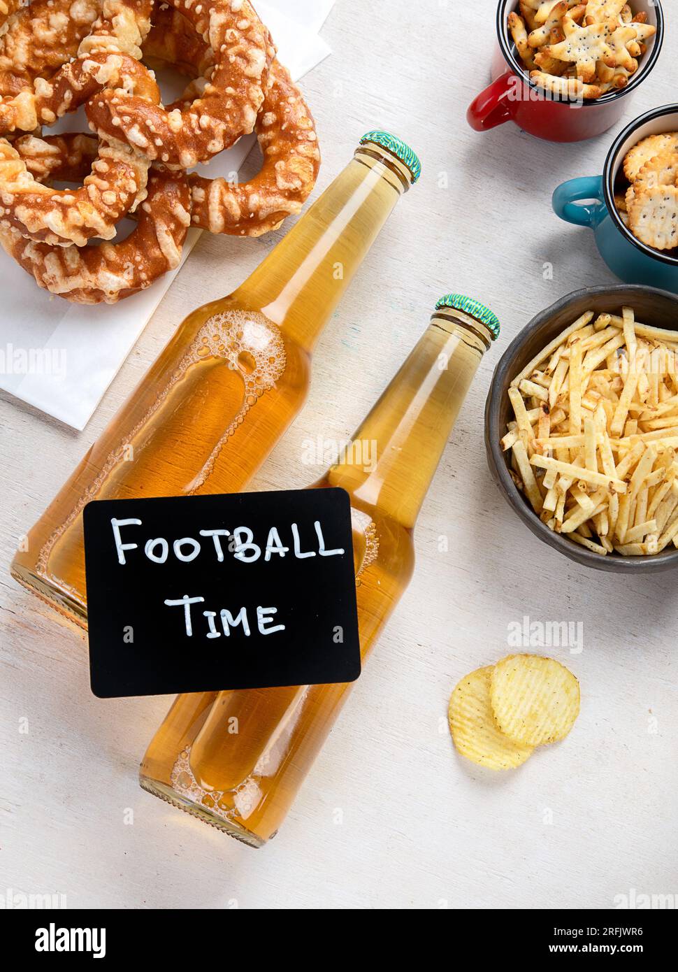 Beer bootles, snacks and ball on table. Top view Stock Photo - Alamy
