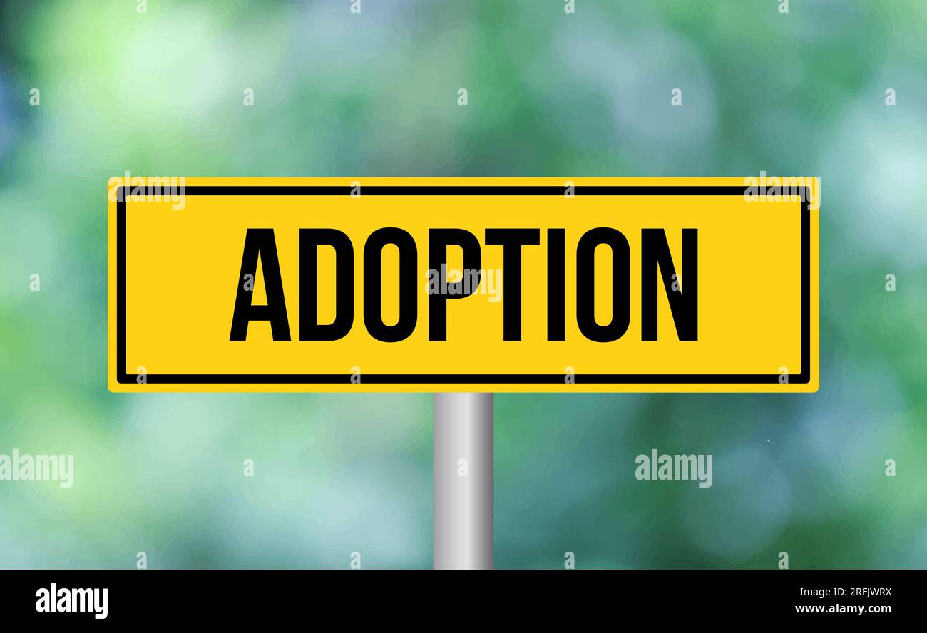 Adoption road sign on blur background Stock Photo Alamy