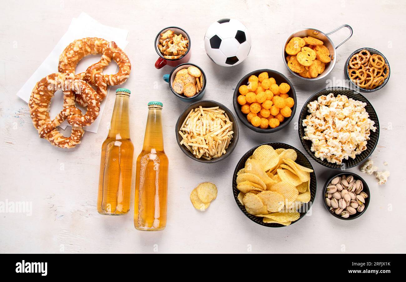 Beer bootles, snacks and ball on table. Top view Stock Photo - Alamy