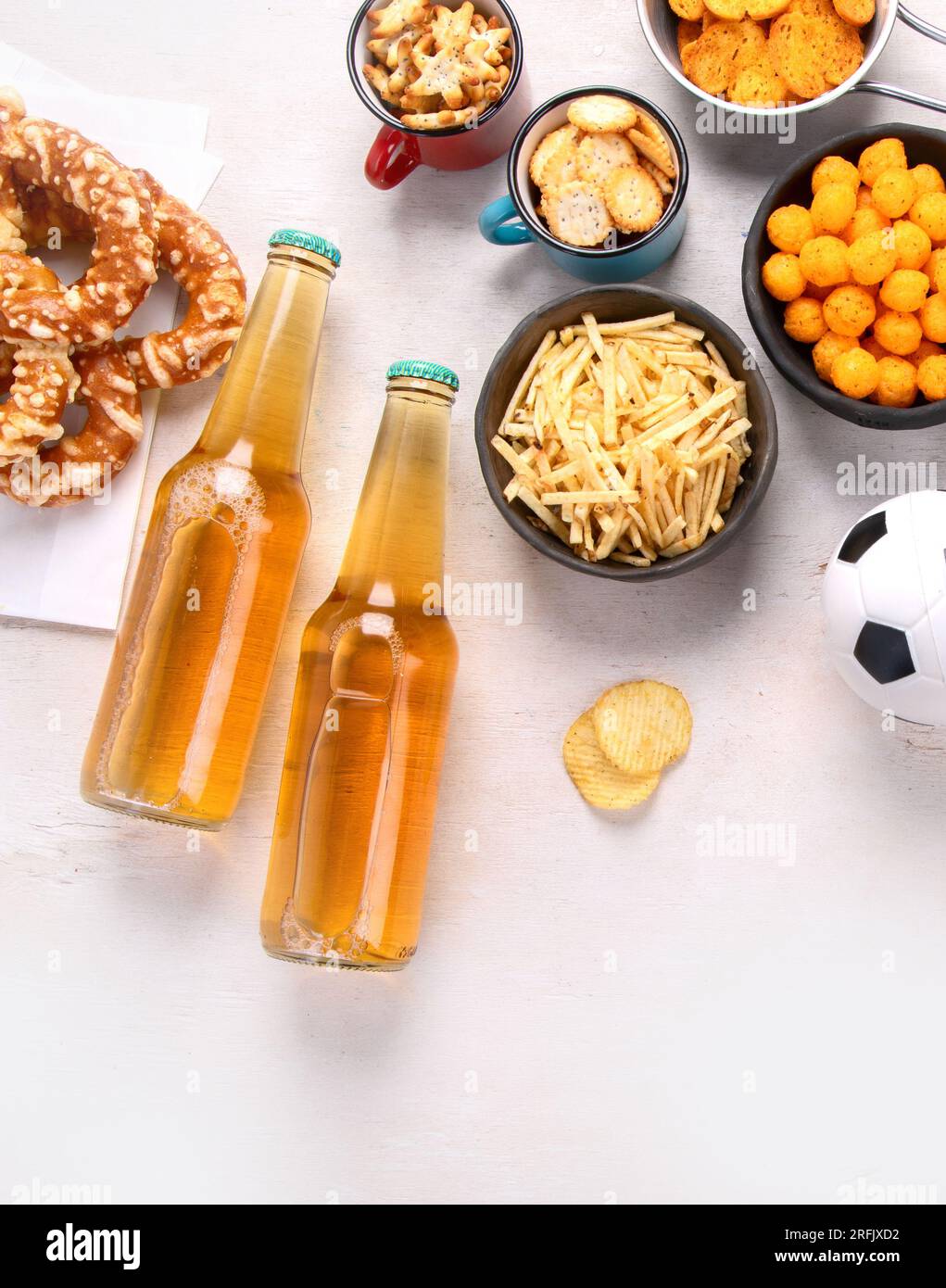 Beer bootles, snacks and ball on table. Top view, copy space Stock ...