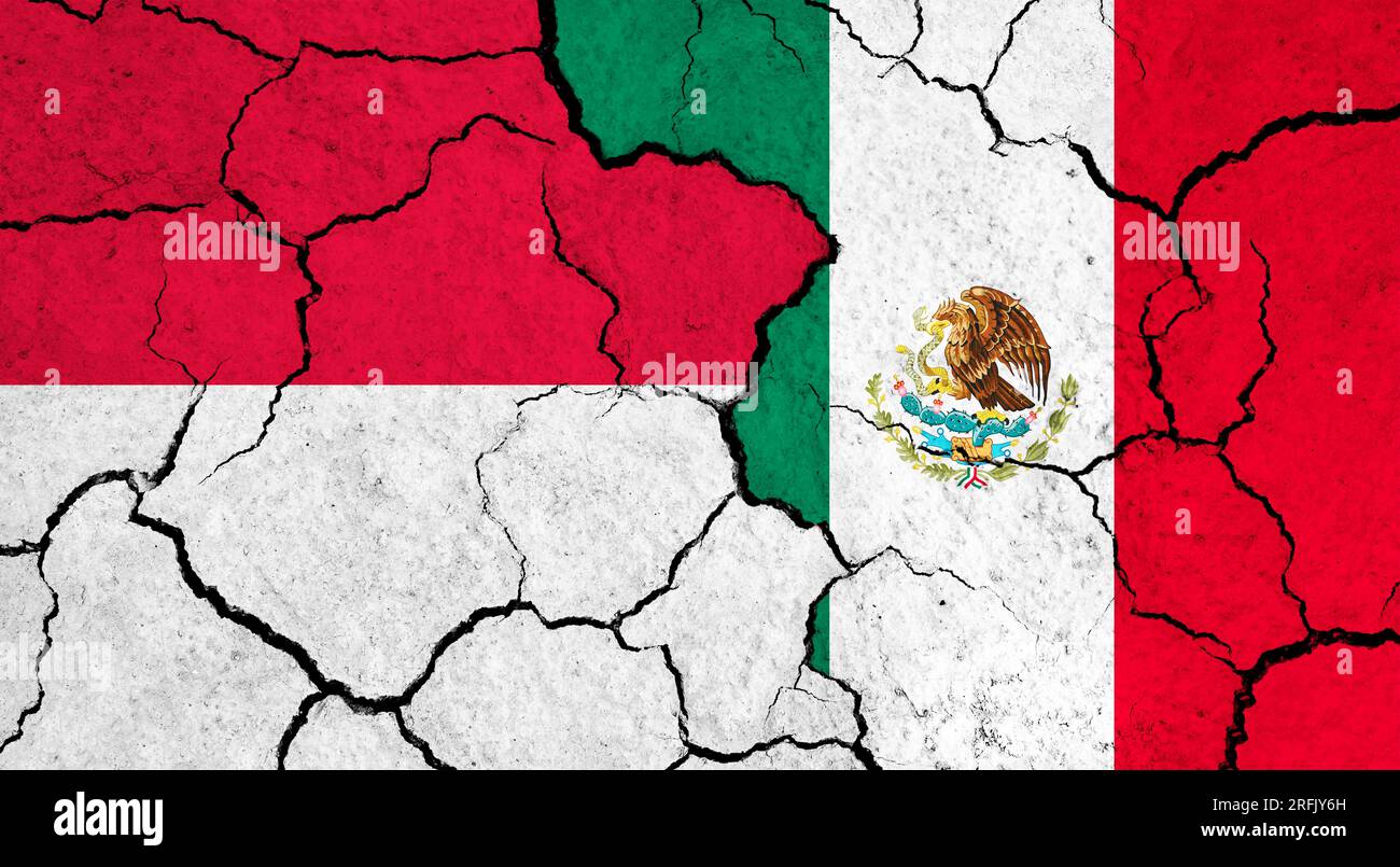 Flags of Indonesia and Mexico on cracked surface politics