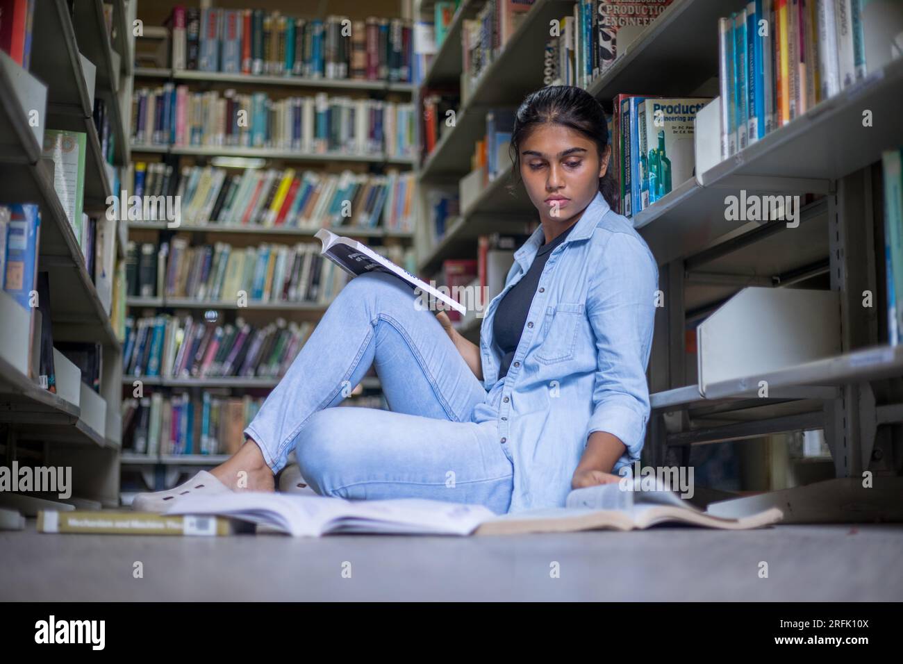 Bangalore, India June 3, 2023 college student reading book time in