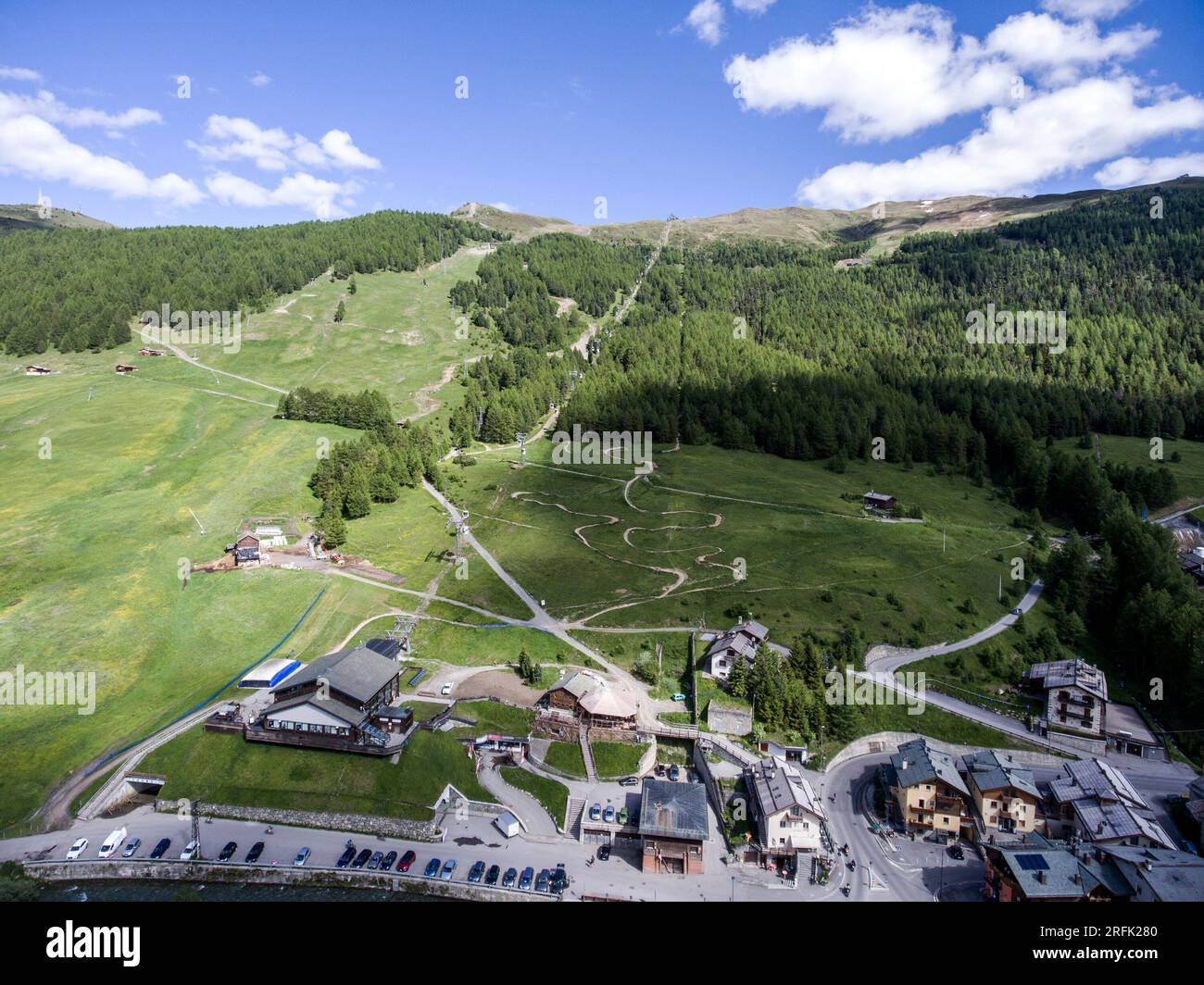 Livigno village ski and Bikepark valley in Valtellina, Lombardia, Italy Aerial view Drone panoramic view. Stock Photo