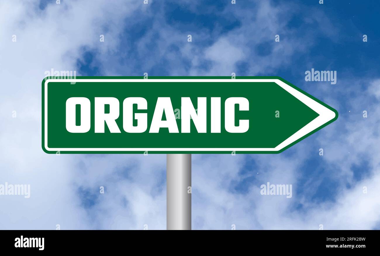 Organic road sign on blue sky background Stock Photo - Alamy