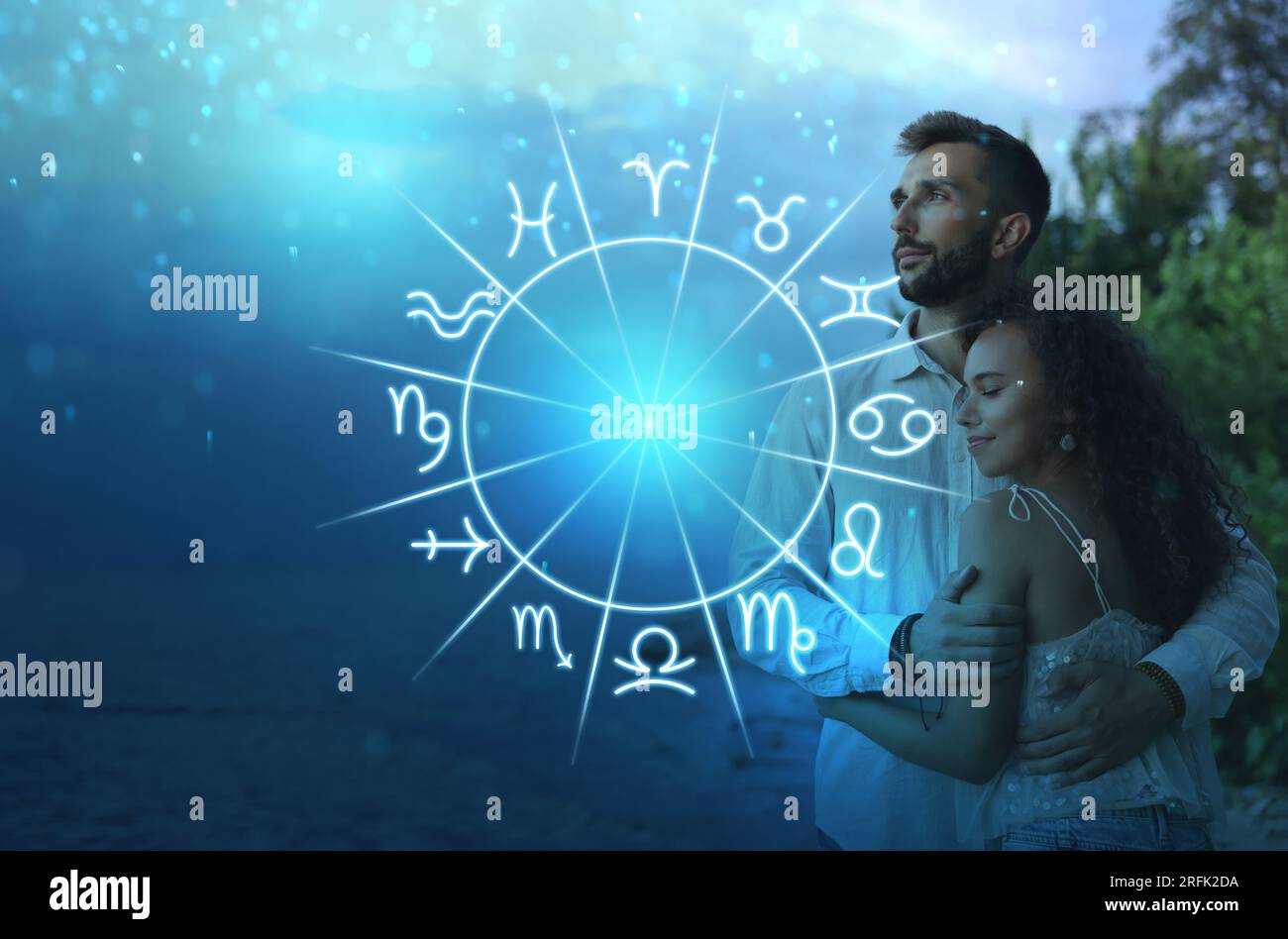 Horoscope compatibility. Loving couple and zodiac wheel Stock Photo