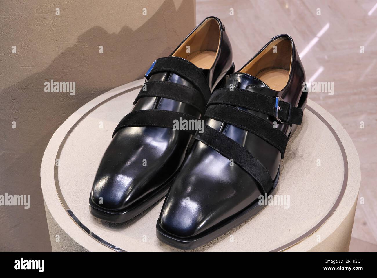 MEN S SHOES ON DISPLAY INSIDE SALVATORE FERRAGAMO FASHION BOUTIQUE