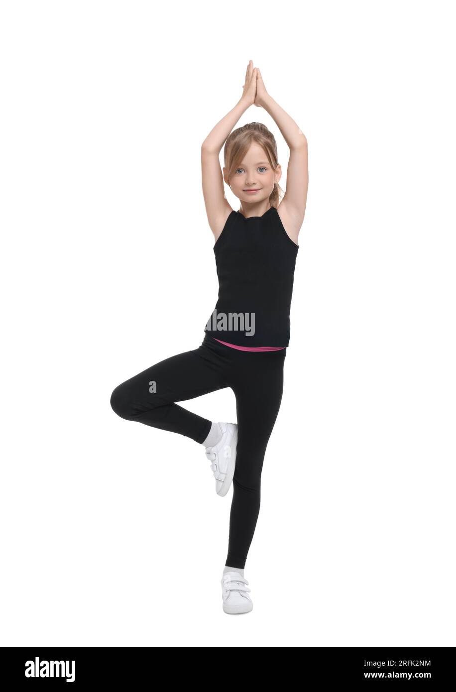 Little girl doing morning exercise on white background Stock Photo - Alamy