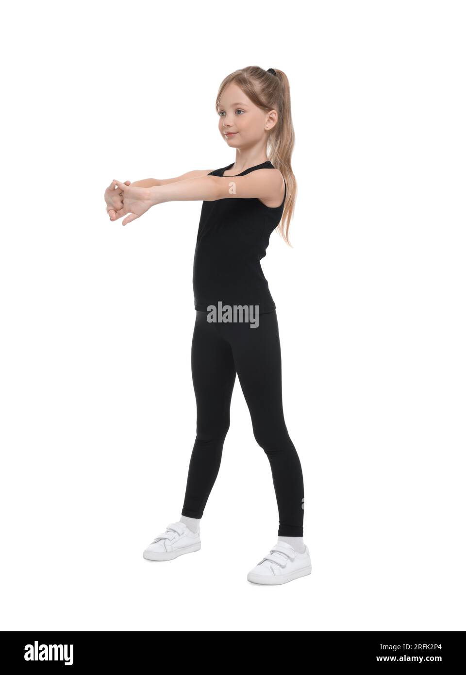 Little girl doing morning exercise on white background Stock Photo - Alamy