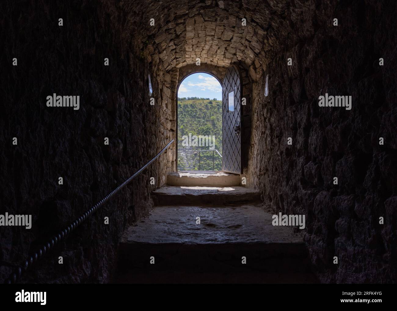 Dark and gloomy dungeon leading to light and beautiful landscape Stock ...