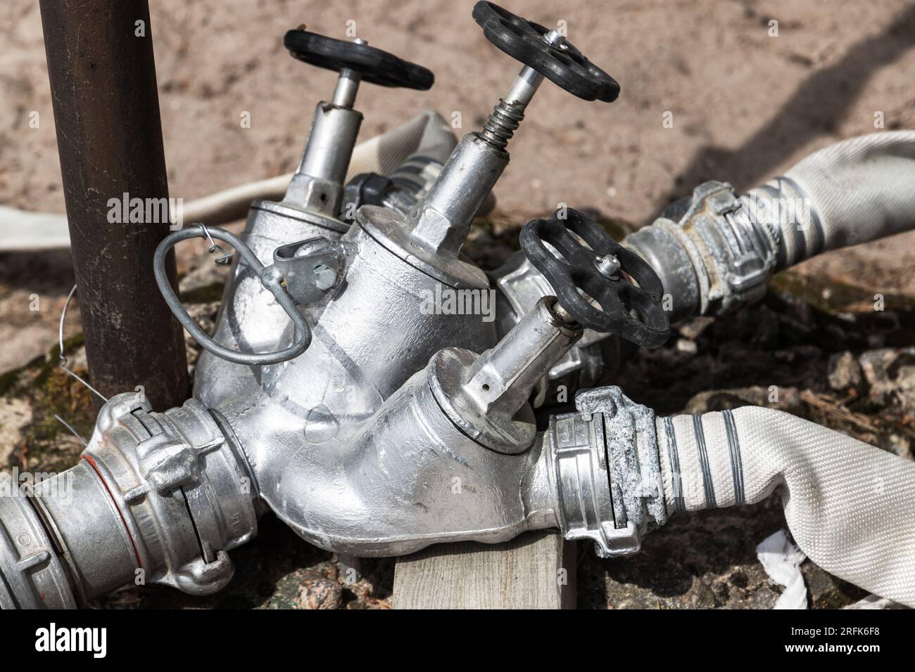 Fire pipe splitter with taps, close up outdoor photo Stock Photo
