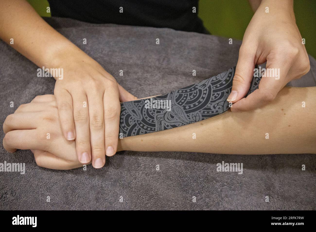 Dynamic taping; muscle pain; physiotherapy; treatment with tape Stock