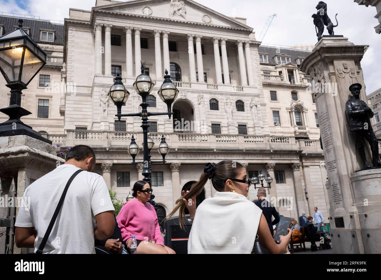 On the day that the Bank of England raised the interest rate by another 0.25% to 5.25%, the fourteenth successive rise in borrowing to help prevent inflation, members of the public walk past the Bank of England in the City of London, the capital's financial district, on 3rd August 2023, in London, England. Stock Photo