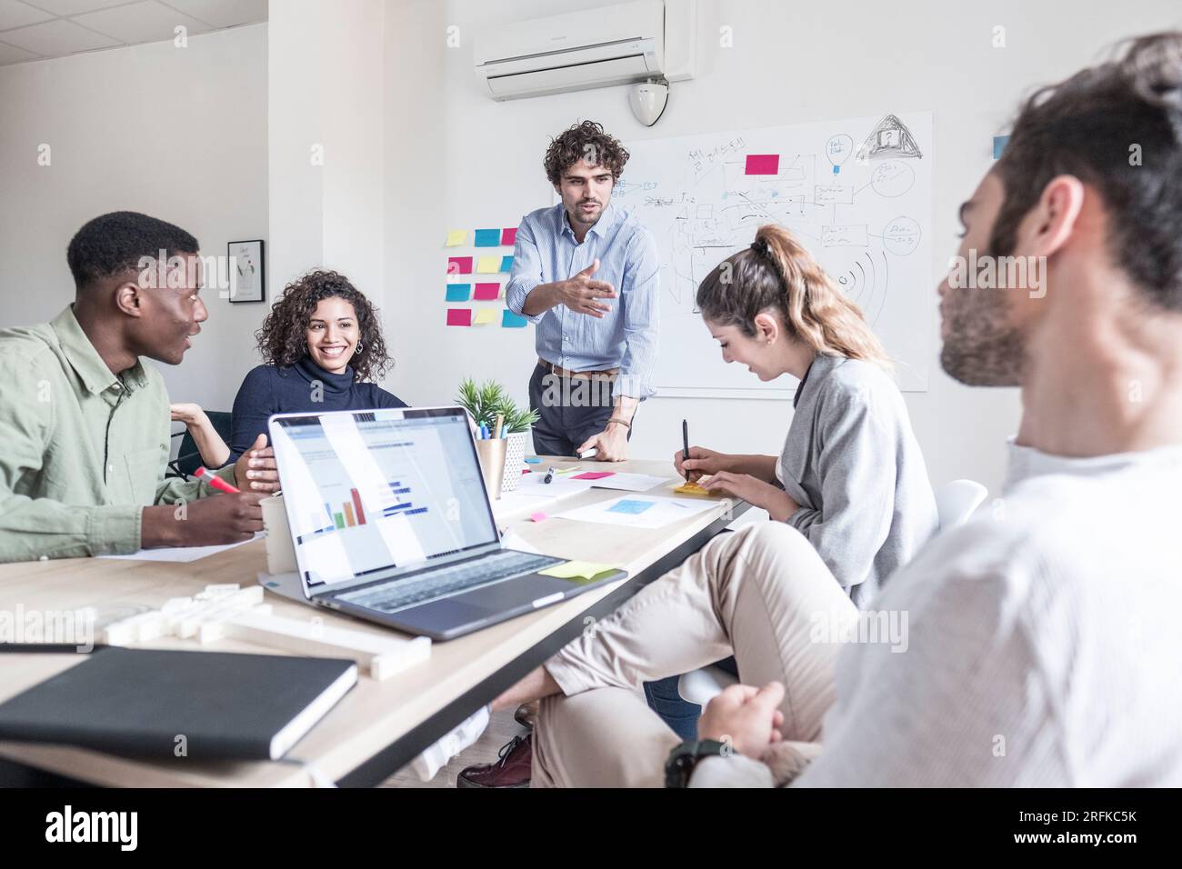 Happy people during a meeting presentation Stock Photo