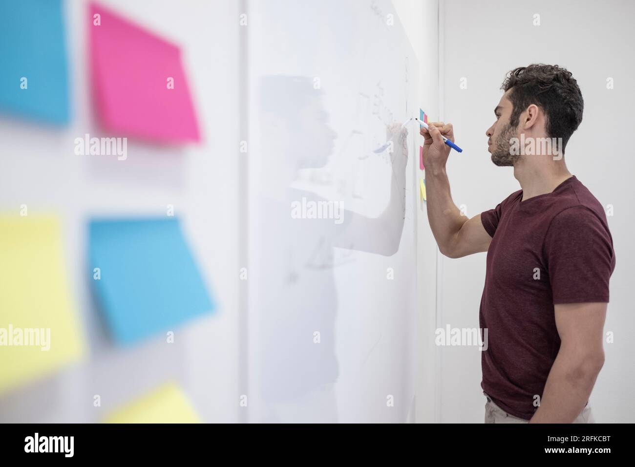 Man giving a presentation on a whiteboard Stock Photo