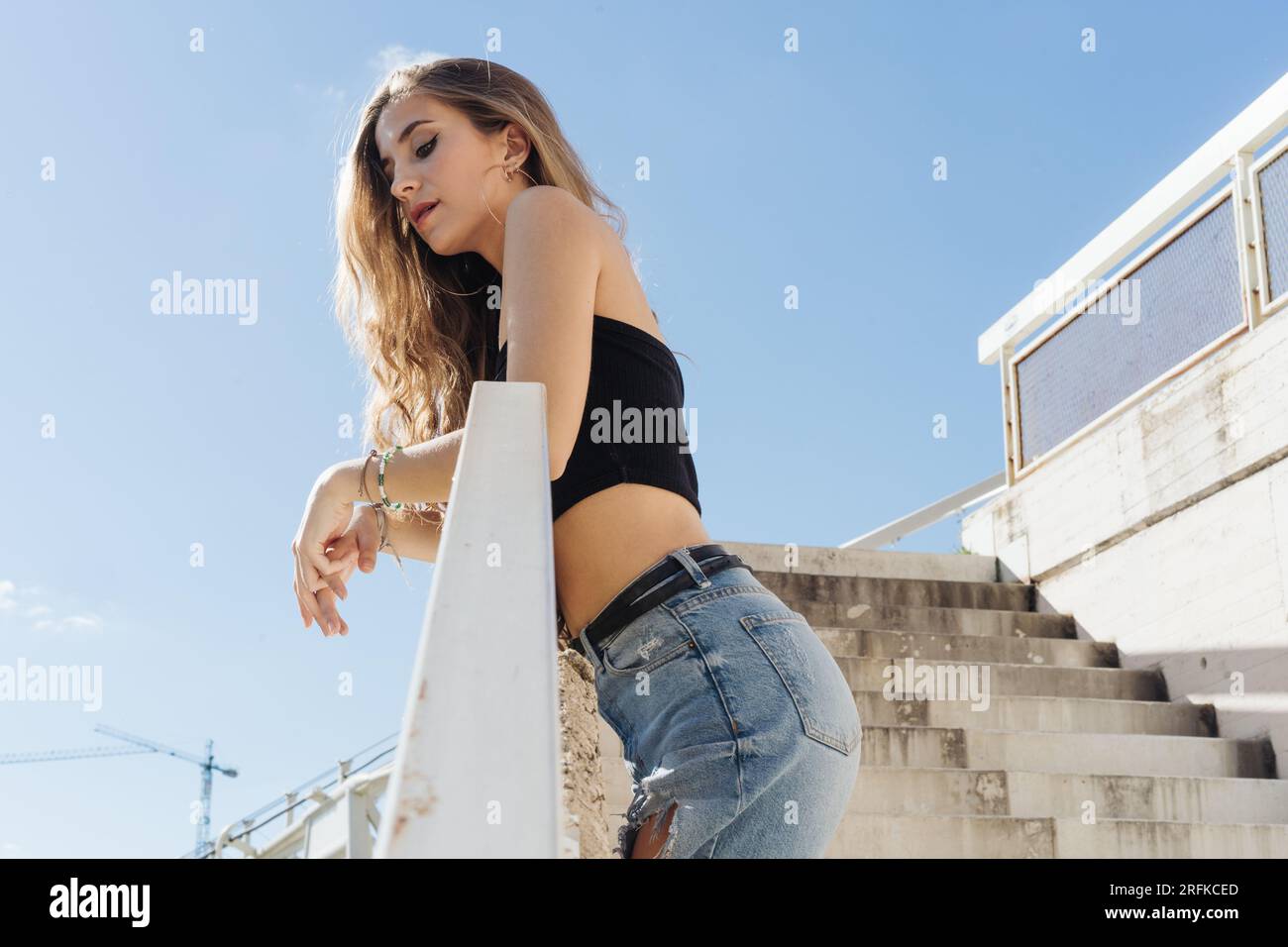 Stylish Girl Sightseeing On A Sunny Day In The City Stock Photo
