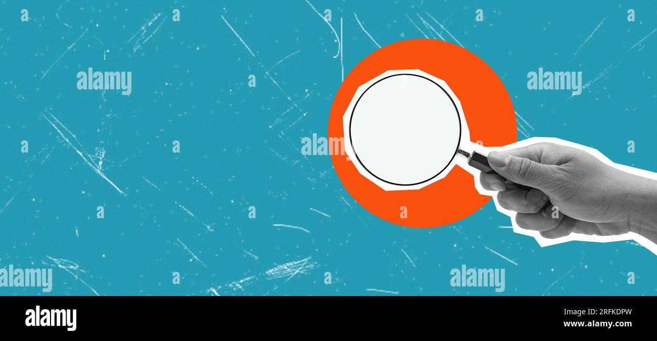 Female hand holding a magnifying glass on a blue background. Layout ...