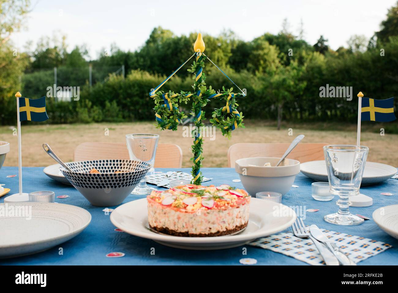 Swedish traditional sandwhich cake on a table at a midsummer party Stock Photo