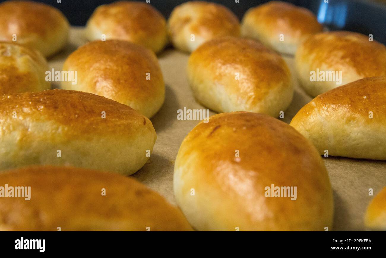 Yeast dough pies with stuffing on a plate. Homemade baking. Photo Stock ...
