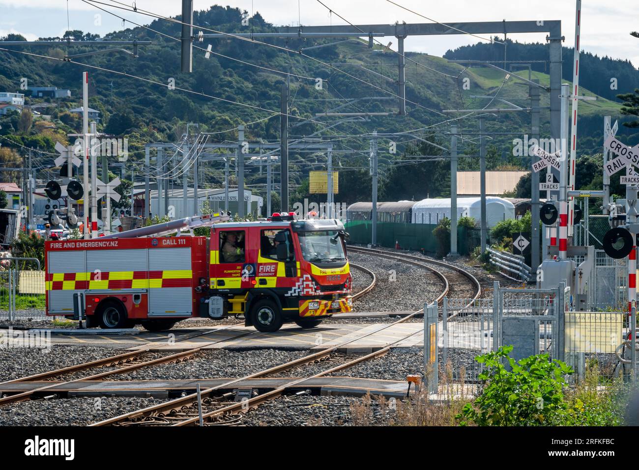 Fire engine on railway level crossing, Plimmerton, Porirua, Wellington, North Island, New Zealand Stock Photo