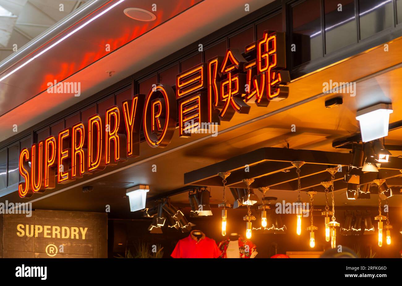 Neon sign Superdry store shop, London Stansted Airport, Essex, England, UK Stock Photo