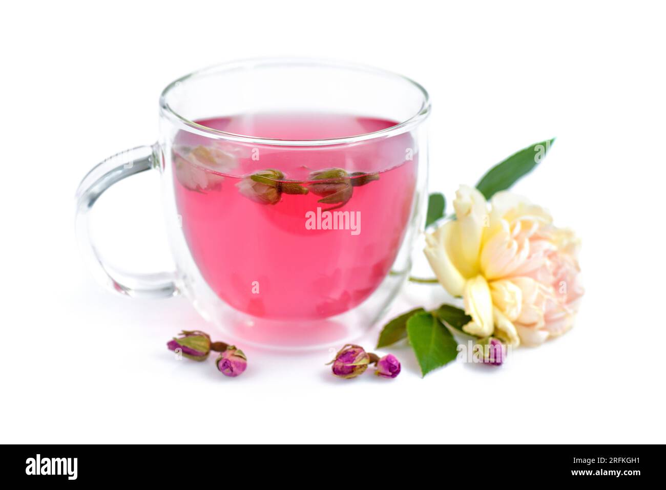 Aqua Rosa Tea Cup of roses tea with rose buds on white background. Selective focus ...