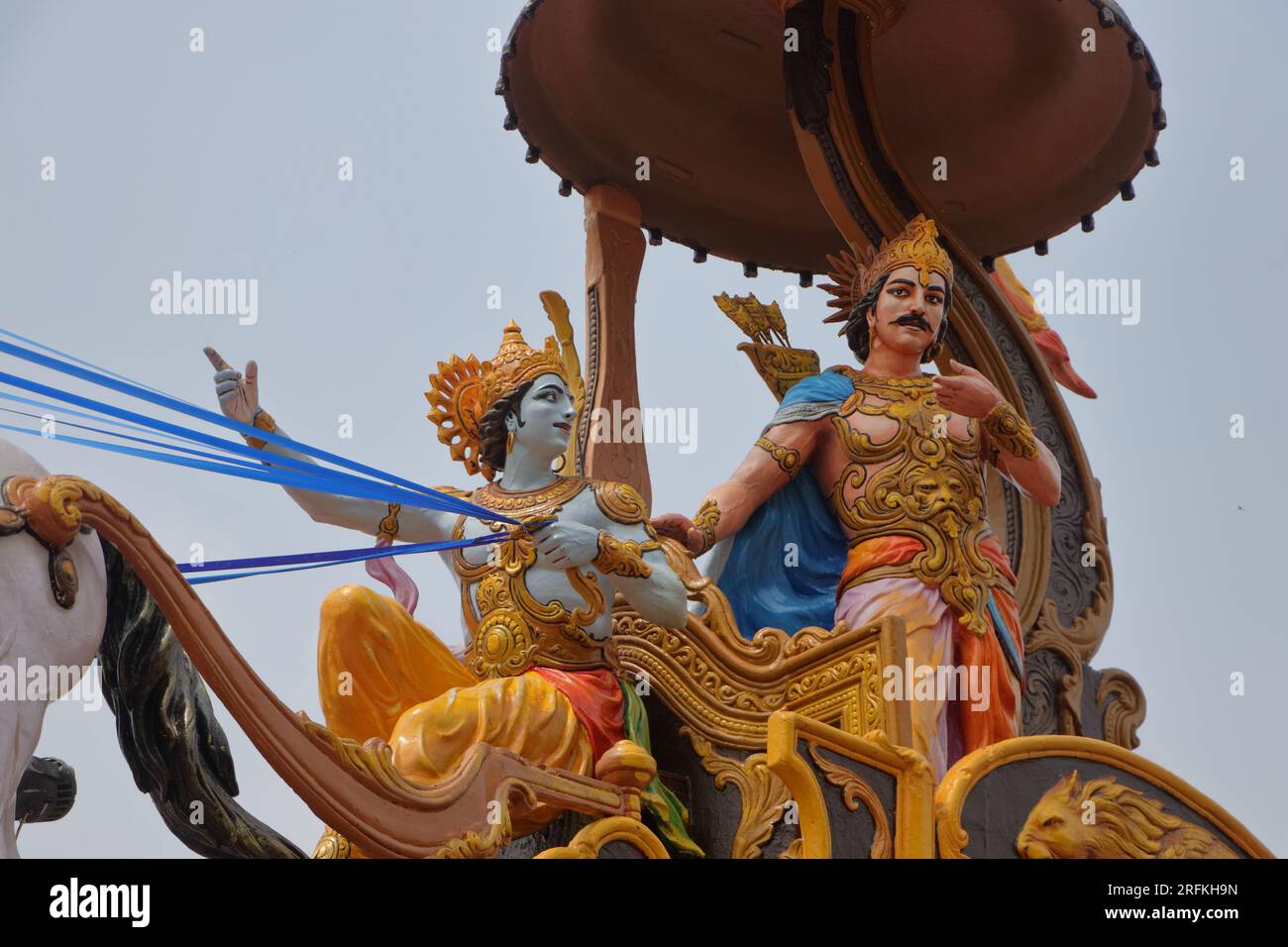 A beautifully colored sculpture showing Shri Krishna as a charioteer preaching to Arjuna during the Mahabharata war. Different angles and focus. Stock Photo