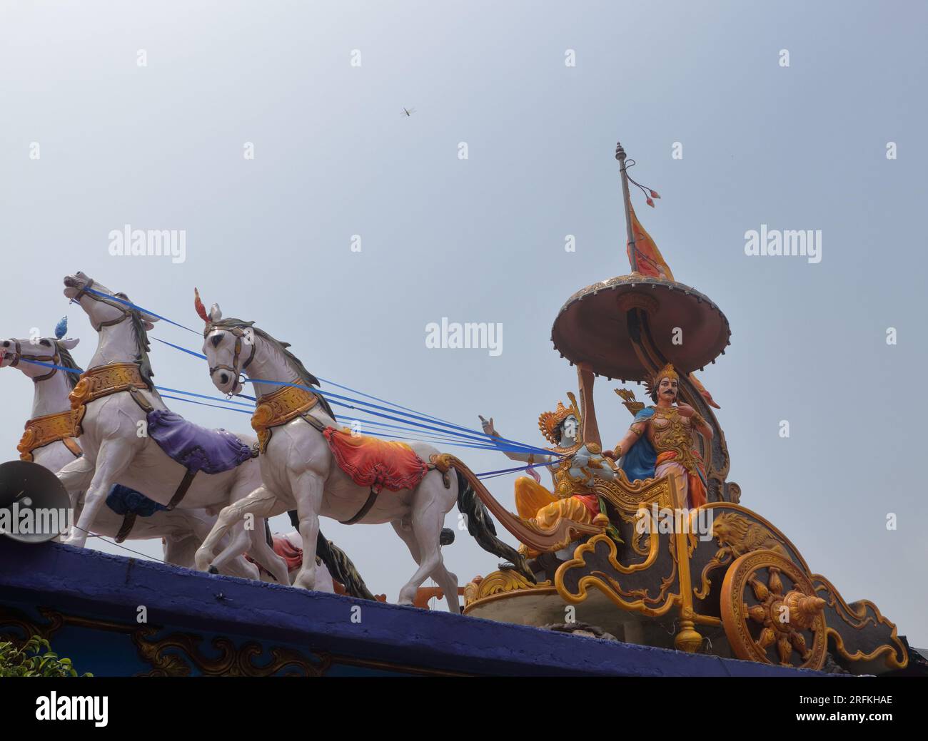 A beautifully colored sculpture showing Shri Krishna as a charioteer preaching to Arjuna during the Mahabharata war. Different angles and focus. Stock Photo