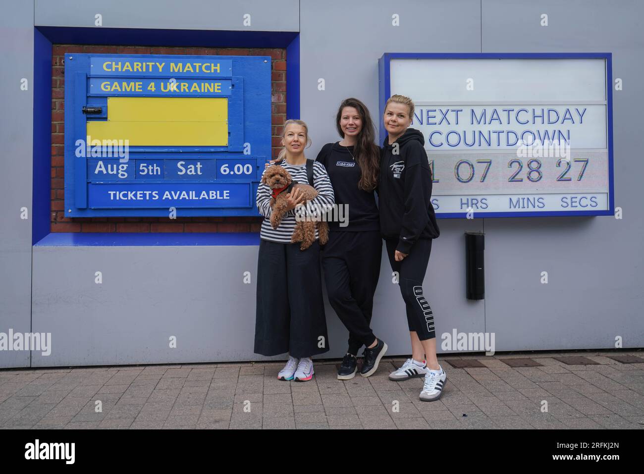 London UK. 4 August 2023 . Natasha, Dasha and Julia from Ukraine  pose next to the Matchday sign at Stamford Bridge. Game4Ukraine  will be played at Stamford Bridge on 5 August with past and present Ukrainian footballers Oleksandr Zinchenko and Andriy Shevchenko to feature as team captains charity football. The  match is to raise money for the United24 initiative, and  to aid Ukraine's rebuilding of facilities and infrastructure that suffered damage from the Russian invasion of Ukraine. Credit amer ghazzal/Alamy Live News Stock Photo