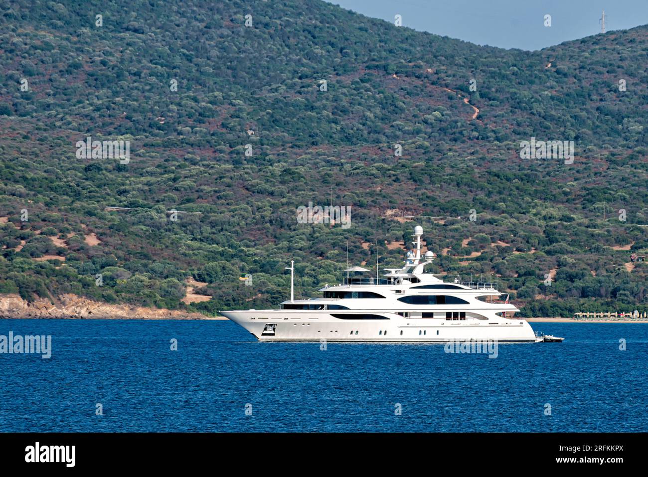 luxury yacht anchoring in a bay in the Mediterranean Sea in Sardegna Stock Photo