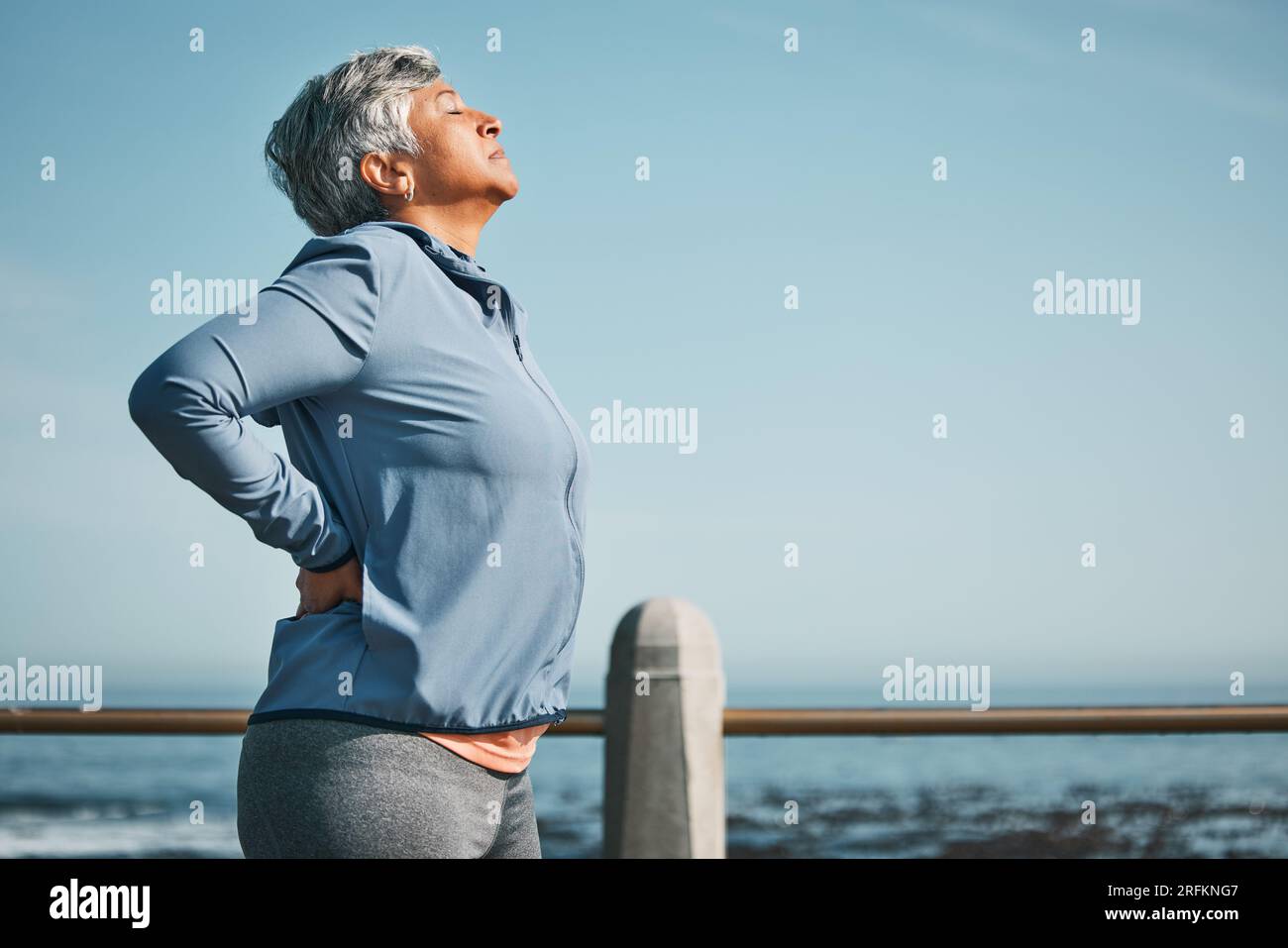 Woman back ache beach hi-res stock photography and images - Alamy