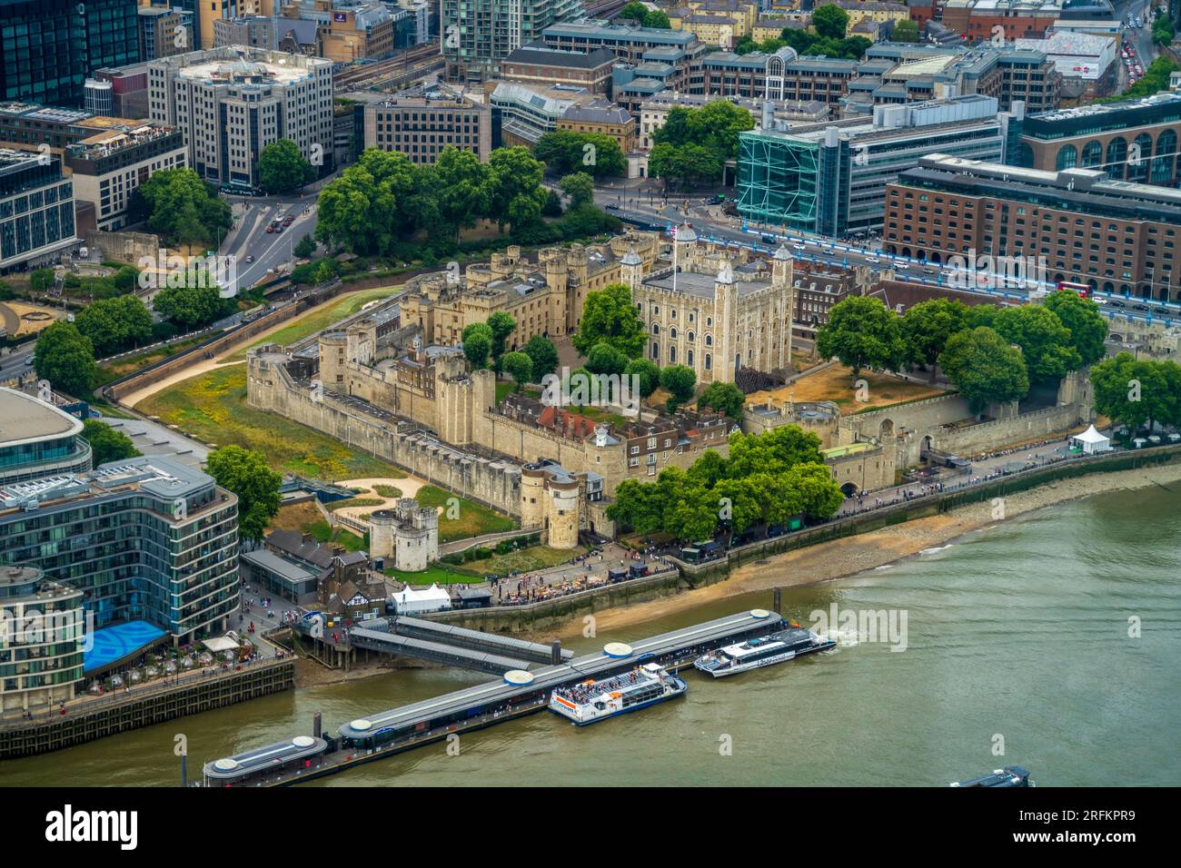 London, England, UK - July 24, 2022. London skyline aerial panoramic view over the Tower of London. The Tower is a historic medieval castle fortress. Stock Photo