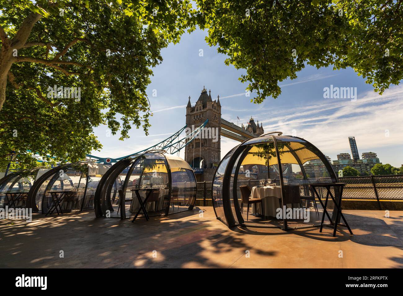 London skyline city view with glass rooms pod dining and the Tower Bridge. A modern enclosed