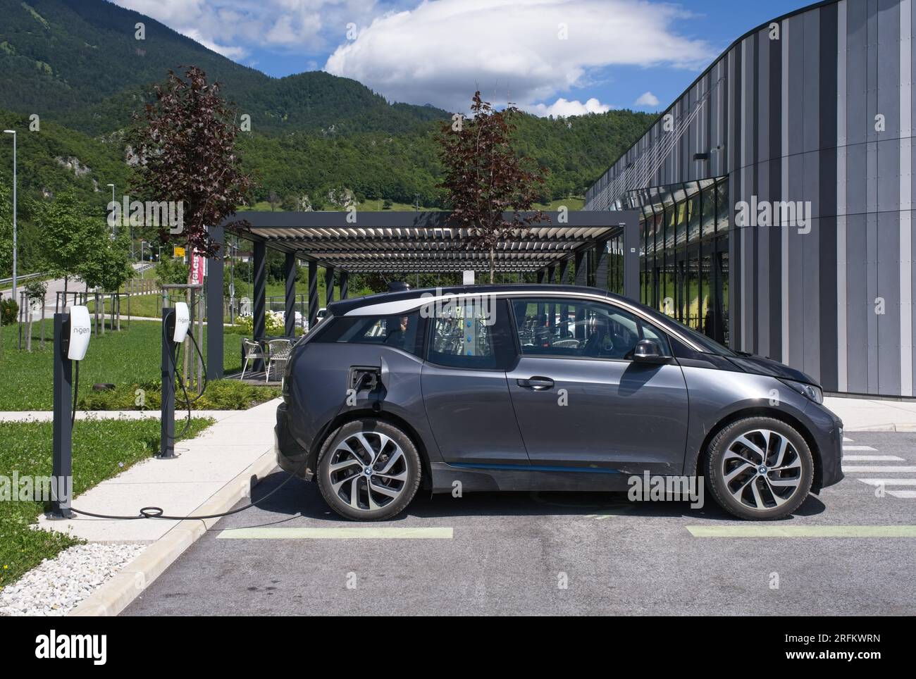 Zirovnica, Slovenia - Jul 27, 2023: A static shot of various electric cars charging at the N.Gen headquarters AC charging station in a sunny summer da Stock Photo