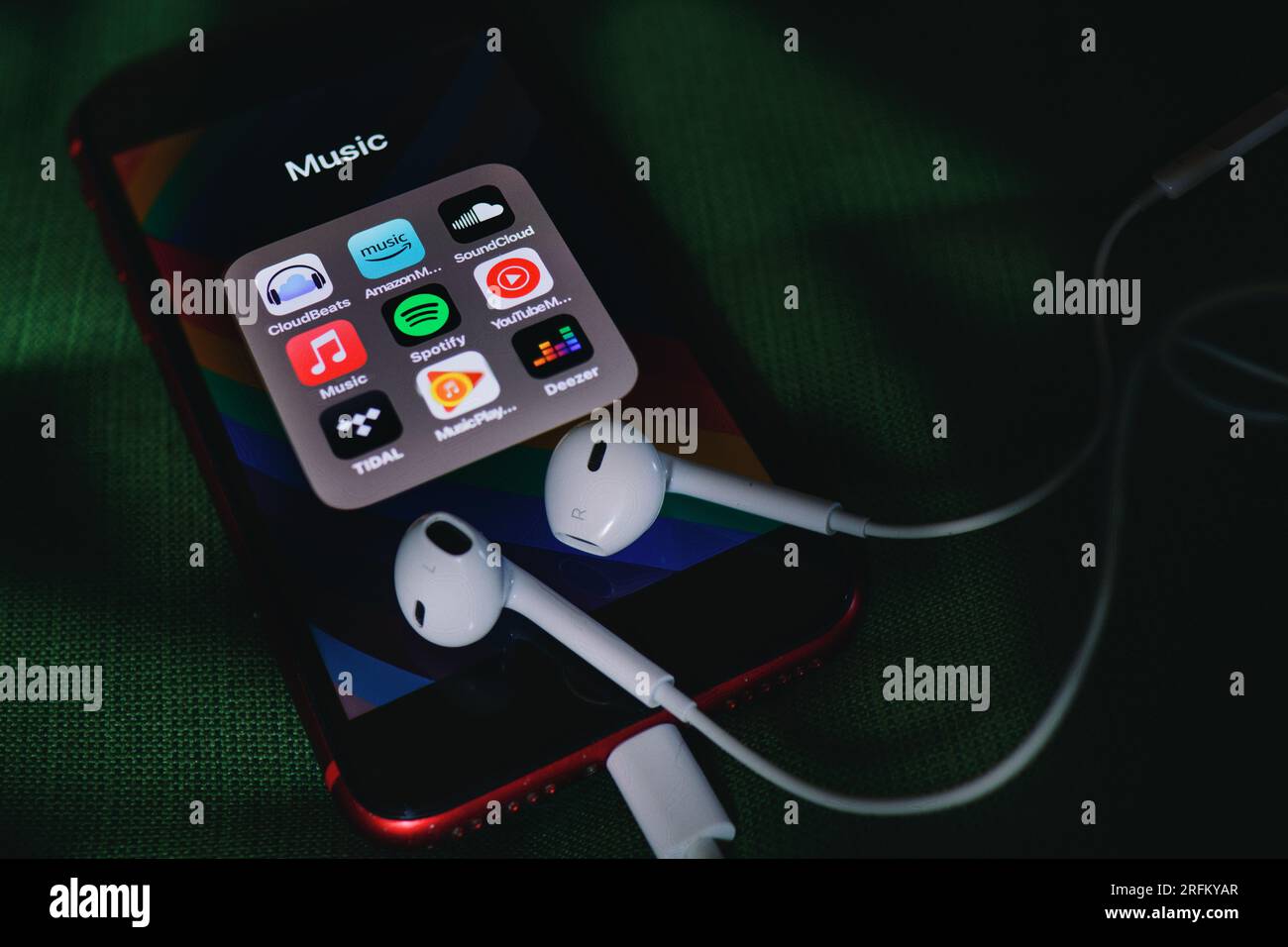 Headsets on smart phone with music app icons Stock Photo Alamy