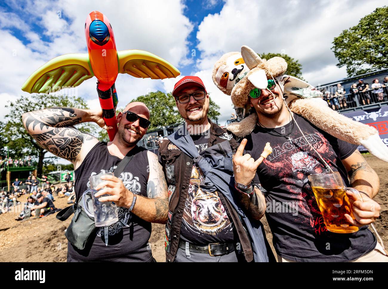 Wacken, Germany. 04th Aug, 2023. Visitors of the Wacken Open Air Festival  celebrate in front of the stages in the so-called "infield". Credit: Axel  Heimken/dpa/Alamy Live News Stock Photo - Alamy